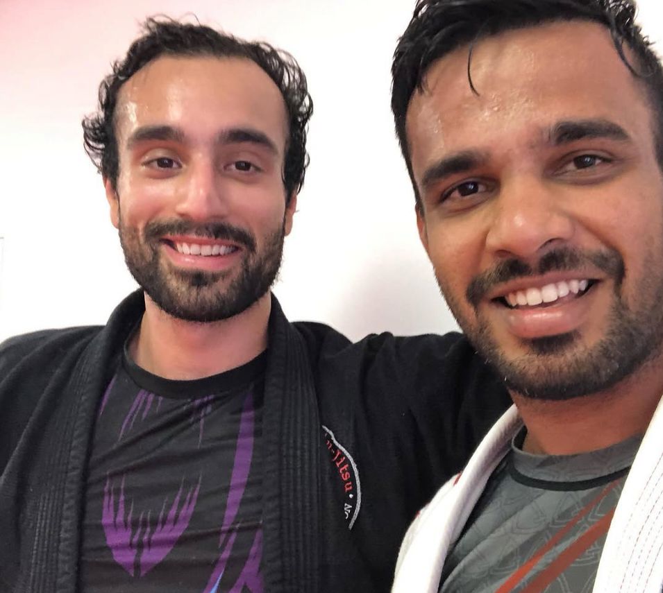 Georgios and a training partner grinning after class